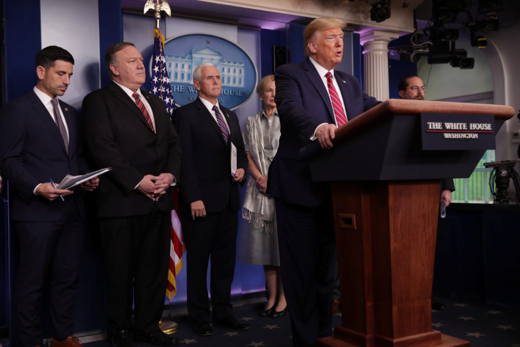 U.S. President Donald Trump addresses his administration's daily coronavirus task force briefing flanked by Acting Secreta...
