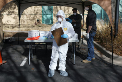 Health care workers prepare a drive-thru testing station run by the state health department, for people who suspect they have novel coronavirus, in Denver, Colorado, U.S. March 11, 2020. REUTERS/Jim Urquhart