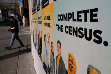 Signs advertising the 2020 U.S. Census cover a closed and boarded up business amid the coronavirus disease (COVID-19) outbreak in Seattle, Washington, U.S., March 23, 2020. REUTERS/Brian Snyder