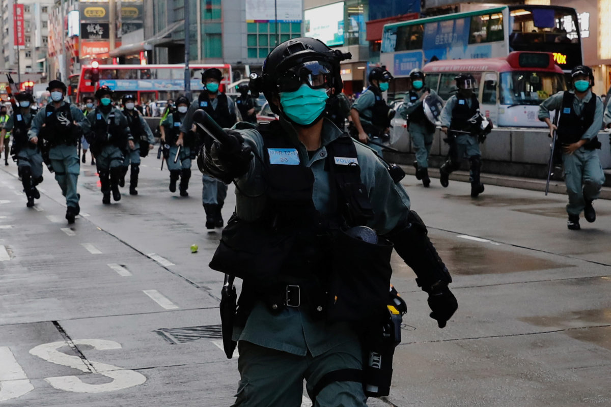 Hong Kong police arrest more than 200 in renewed protests | PBS NewsHour