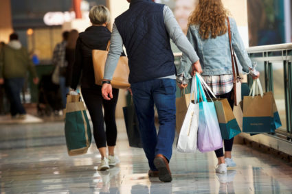 FILE PHOTO: Shoppers carry bags of purchased merchandise at the King of Prussia Mall, United States' largest retail shopping space, in King of Prussia, Pennsylvania, U.S., December 8, 2018. Photo by REUTERS/Mark Makela/File Photo