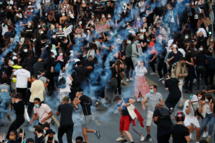 Paris police use tear gas against protesters as global outrage continues