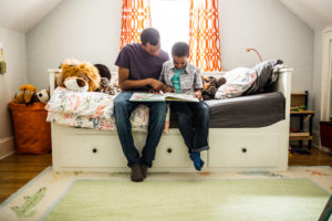 Father and son reading