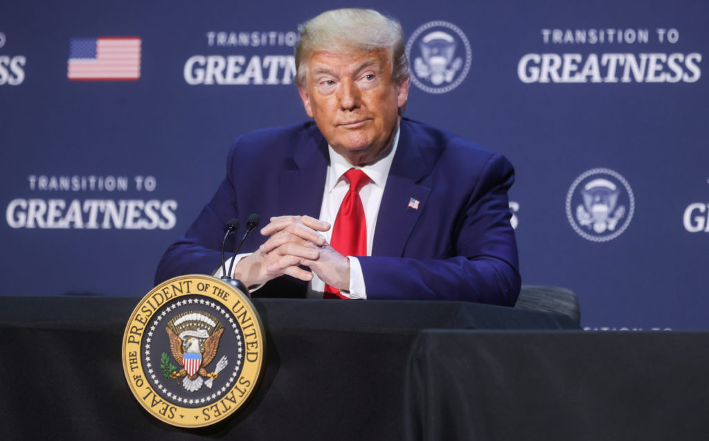 U.S. President Donald Trump listens during a roundtable discussion with members of the faith community, law enforcement an...