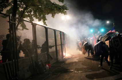 Protests in Portland grow to 'many thousands' as police and federal forces converge in the city