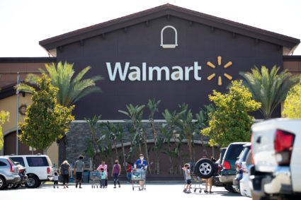 Shopper wearing face masks are pictured in the parking of a Walmart Superstore during the outbreak of the coronavirus disease (COVID-19), in Rosemead, California, U.S., June 11, 2020. Picture taken June 11, 2020. Photo by Mario Anzuoni/Reuters