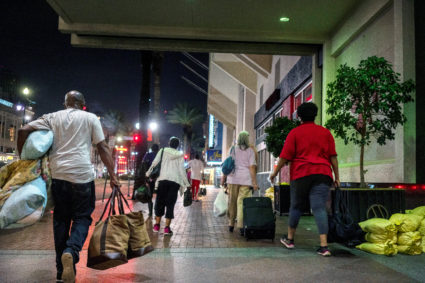 Hurricanes and wildfires are compounding the risks of the pandemic