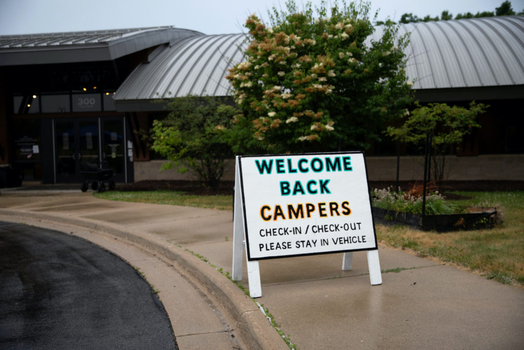 Children arrive for check-in amid the coronavirus disease (COVID-19) at Carls Family YMCA summer camp in Milford, Michigan...