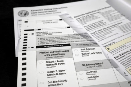 An absentee ballot and required paperwork await preparations at the Wake County Board of Elections on the first day that the state started mailing them out, in Raleigh, North Carolina, U.S. September 4, 2020. Photo by REUTERS/Jonathan Drake