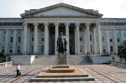 A man walks away from the U.S Treasury Department in Washington, U.S., August 6, 2018. Photo by Brian Snyder/REUTERS