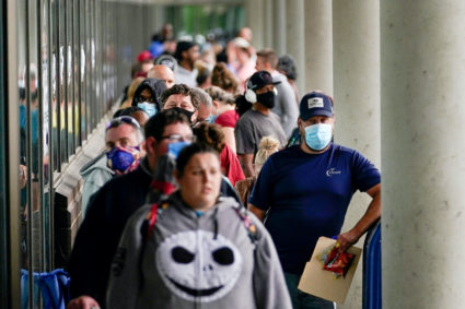 Hundreds of people line up outside a Kentucky Career Center hoping to find assistance with their unemployment claim in Frankfort, Kentucky, U.S. June 18, 2020.