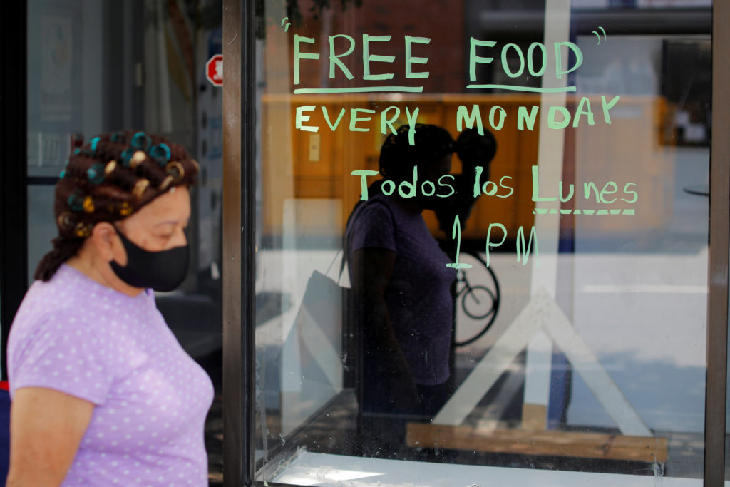 pedestrian walks near food pantry