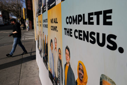 Signs advertising the 2020 U.S. Census cover a closed and boarded up business amid the coronavirus disease (COVID-19) outbreak in Seattle, Washington, U.S., March 23, 2020. Photo by Brian Snyder/REUTERS