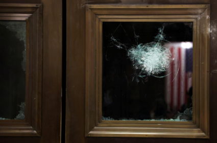 A broken window is seen during a joint session of Congress after they reconvened to certify the Electoral College votes of the 2020 presidential election in the House chamber in Washington, U.S. January 7, 2021. Photo by Jonathan Ernst/REUTERS