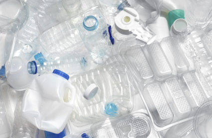 A close up of a pile of clean, empty plastic containers