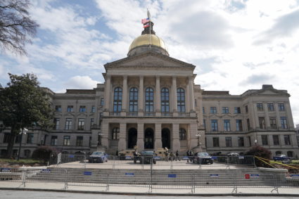 National Guard and Georgia State troopers stand guard outside the Georgia State Capitol in Atlanta, Georgia, U.S. January 17, 2021. Photo by Elijah Nouvelage/REUTERS