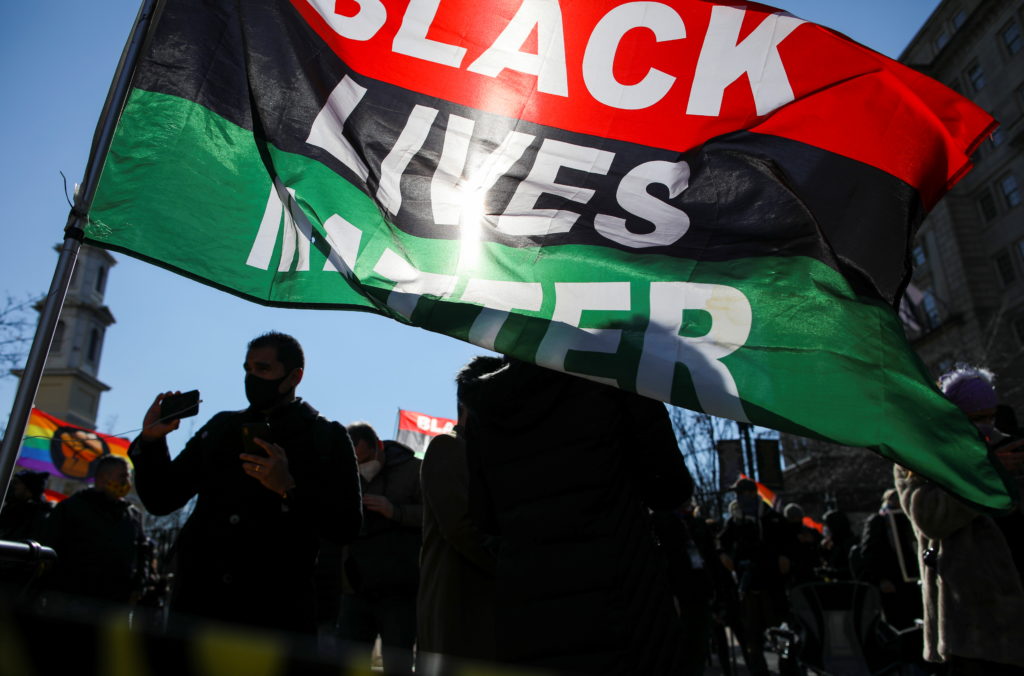 Supporters of U.S. President Joe Biden celebrate after he was sworn in as the 46th President of the United States, at Blac...