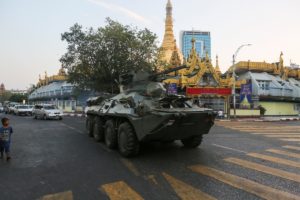An armoured vehicle rides on a street during a protest against the military coup, in Yangon, Myanmar, February 14, 2021. REUTERS/Stringer