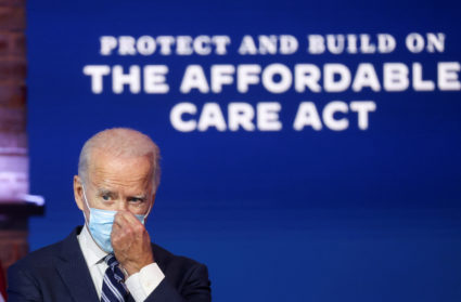 U.S. President-elect Joe Biden adjusts his face mask after during a news conference, where he discussed health care and the Affordable Care Act (Obamacare) at the theater serving as his transition headquarters in Wilmington, Delaware, U.S., November 10, 2020. Photo by Reuters/Jonathan Ernst/File Photo