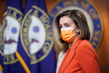 Speaker of the House Nancy Pelosi (D-CA) listens as House and Senate lawmakers speak on gun violence legislation on Capitol Hill in Washington, U.S., March 11, 2021. Photo by Joshua Roberts/Reuters.