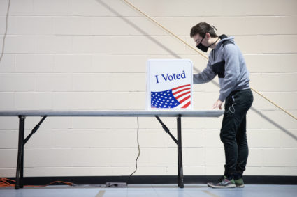 First-time voter Alex Jimenez uses a voting machine on November 3, 2020 in Columbia, South Carolina. After a record-breaking early voting turnout, Americans head to the polls on the last day to cast their vote for incumbent U.S. President Donald Trump or Democratic nominee Joe Biden in the 2020 presidential election. Photo by Sean Rayford/Getty Images