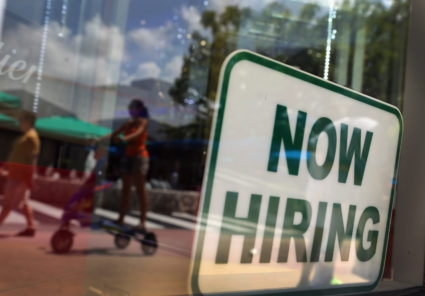 A ''Now Hiring'' sign is seen in the store front window on July 5, 2012 in Miami Beach, Florida. The ADP released the National Employment Report which showed that employment in the U.S. nonfarm private business sector increased by 176,000 from May to June on a seasonally adjusted basis.The government will release its closely watched employment report for June on Friday. Photo by Joe Raedle/Getty Images
