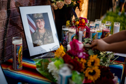 People lay down flowers in honor of murdered Army Spec. Vanessa Guillen at a march and vigil on July 12, 2020 in Austin, Texas. Guillen, who was allegedly murdered at Fort Hood by fellow soldier, Spec. Aaron Robinson, has come into the national spotlight with many calling on the military to further investigate the culture of sexual harassment and assault against female service members. Photo by Sergio Flores/Getty Images