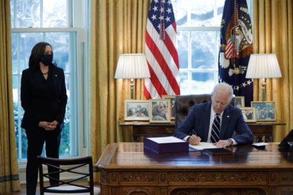U.S. President Joe Biden signs the American Rescue Plan, a package of economic relief measures to respond to the impact of the coronavirus disease (COVID-19) pandemic, inside the Oval Office at the White House in Washington, U.S., March 11, 2021.