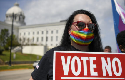 Destiny Clark holds a sign during a rally at the Alabama State House to draw attention to anti-transgender legislation introduced in Alabama on March 30, 2021 in Montgomery, Alabama. Photo by Julie Bennett/Getty Images
