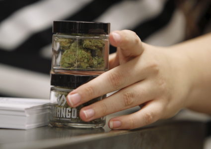 Employees at Shango Cannabis shop sell legal recreational marijuana beginning at midnight in Portland, Oregon October 1, 2015. The sale of marijuana for recreational use began in Oregon on October 1, 2015 as it joined Washington state and Colorado in allowing the sale of a drug that remains illegal under U.S. federal law. Photo by Steve Dipaola/REUTERS