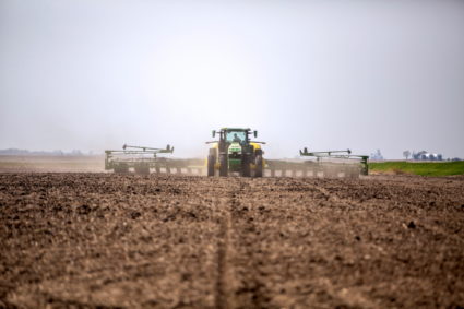 Chris Hays drives a new tractor and planter during spring planting at their farm in Malvern, Iowa, U.S., April 27, 2021. Photo by Rachel Mummey/REUTERS