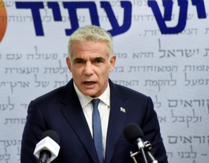 Yair Lapid, head of the centrist Yesh Atid party, delivers a statement to the press before the party faction meeting at the Knesset, Israel's parliament, in Jerusalem May 31, 2021. Photo by Debbie Hill/Pool via REUTERS