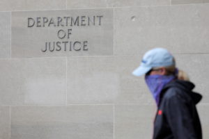 Signage is seen at the headquarters of the United States Department of Justice (DOJ) in Washington, D.C., U.S., May 10, 2021. Photo by Andrew Kelly/REUTERS