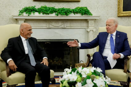 President Joe Biden talks with Afghan President Ashraf Ghani
