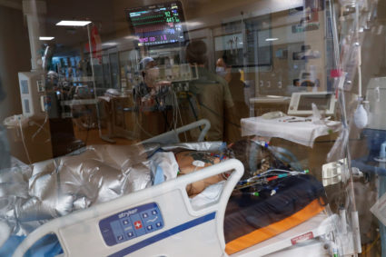 FILE PHOTO: A coronavirus disease (COVID-19) positive patient lies in a bed in the intensive care unit (ICU) at Sarasota M...