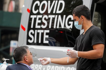 A man receives a coronavirus disease (COVID-19) test at a mobile testing van in Brooklyn, New York