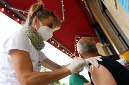 FILE PHOTO: Medical assistant Jana gives a Johnson &amp; Johnson COVID-19 vaccine injection during vaccination at the Revo...