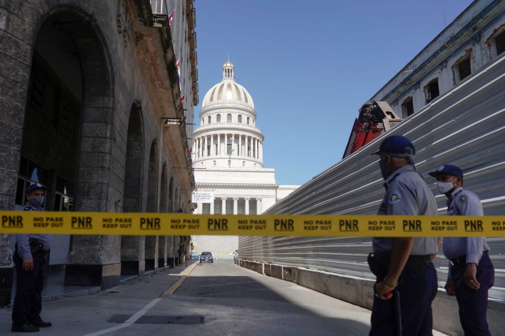 A police line is seen blocking a road leading to the National Capitol Building in Havana