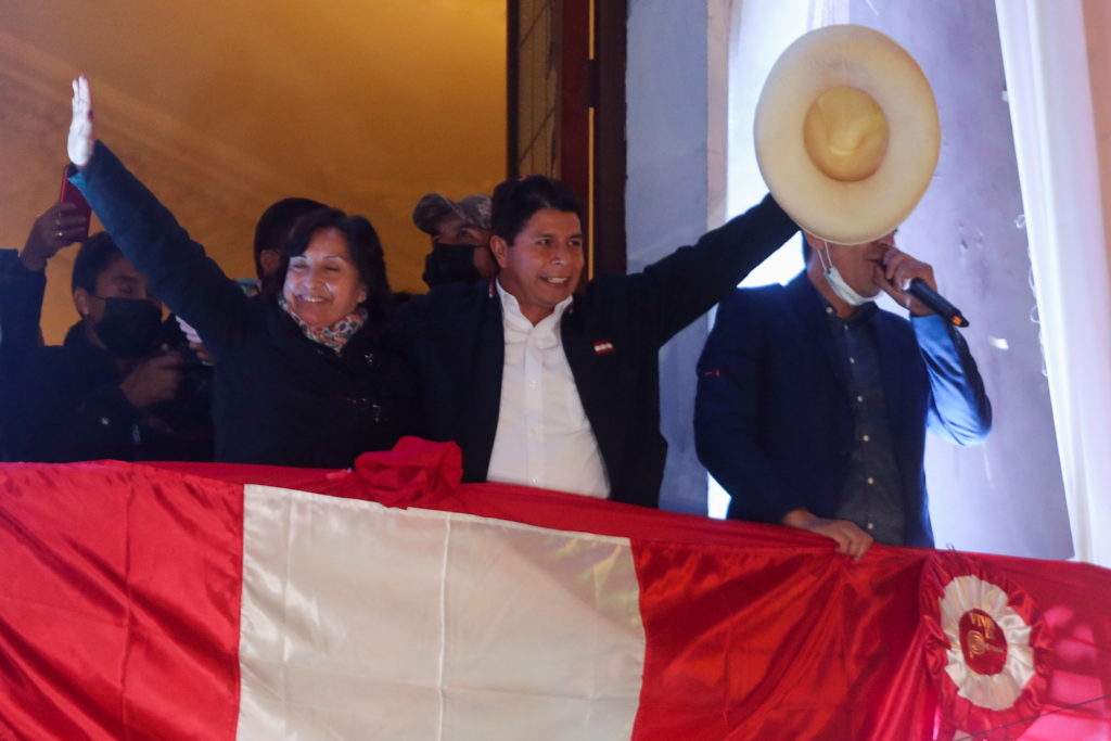 Leftist Pedro Castillo celebrates after Peru's electoral authority announced him as the winner of the presidential electio...