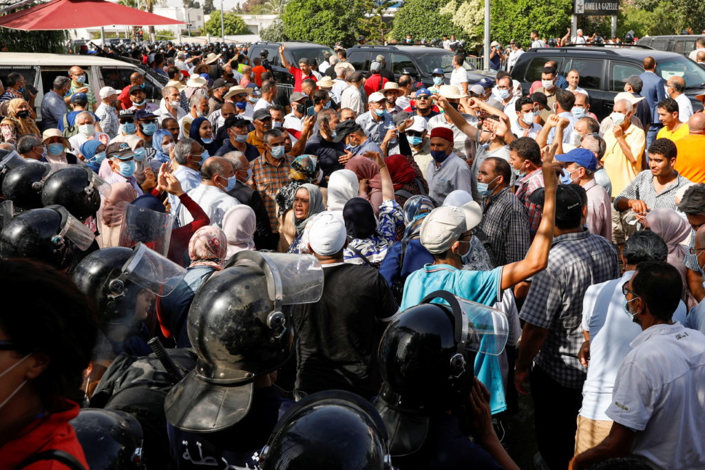 Tunisians gather after president ousts government, in Tunis