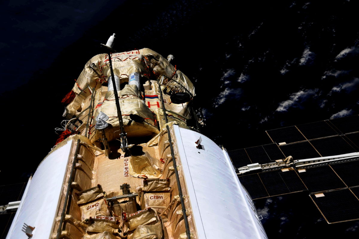 Russian lab module docks with space station after 8-day trip | PBS NewsHour