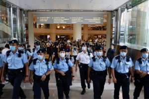 Police ask supporters to leave during the court hearing of Tong Ying-kit, the first person charged under a new national se...