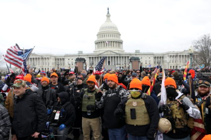 Members of the far-right group Proud Boys make 'OK' hand gestures indicating "white power" as supporters of U.S. President Donald Trump gather in front of the U.S. Capitol Building to protest against the certification of the 2020 U.S. presidential election results by the U.S. Congress, in Washington, U.S., January 6, 2021. Photo by Jim Urquhart/REUTERS