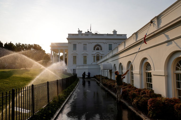 Workers clean the facade in the hours before U.S. President Joe Biden and German Chancellor Angela Merkel's meeting at the...