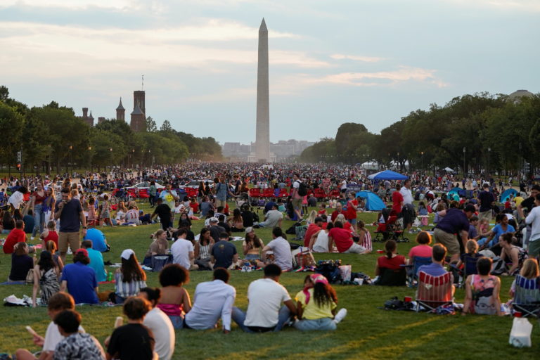 People gather for the annual Independence Day fireworks celebration at the National Mall in Washington