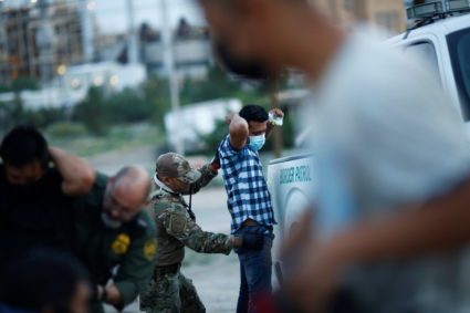 Migrants from Central America crossing into the United States from Mexico, in New Mexico