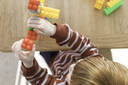 Baby Boy Playing with Colorful Blocks