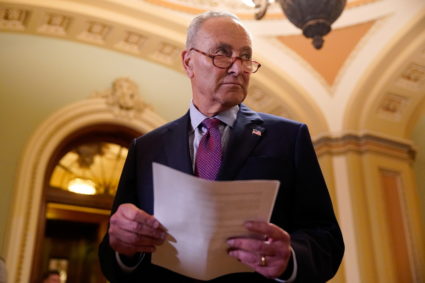 U.S. Senate Majority Leader Chuck Schumer (D-NY) looks down the hall after speaking to reporters following a weekly Senate...