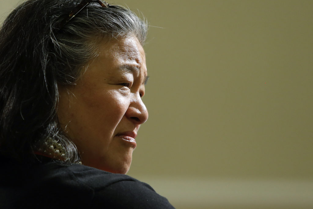 Tina Tchen listens during a discussion between Michelle Obama and school nutrition experts about issues in school food pro...