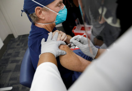 FILE PHOTO: Health Care workers receive the Pfizer-BioNTech COVID-19 Vaccine in Florida